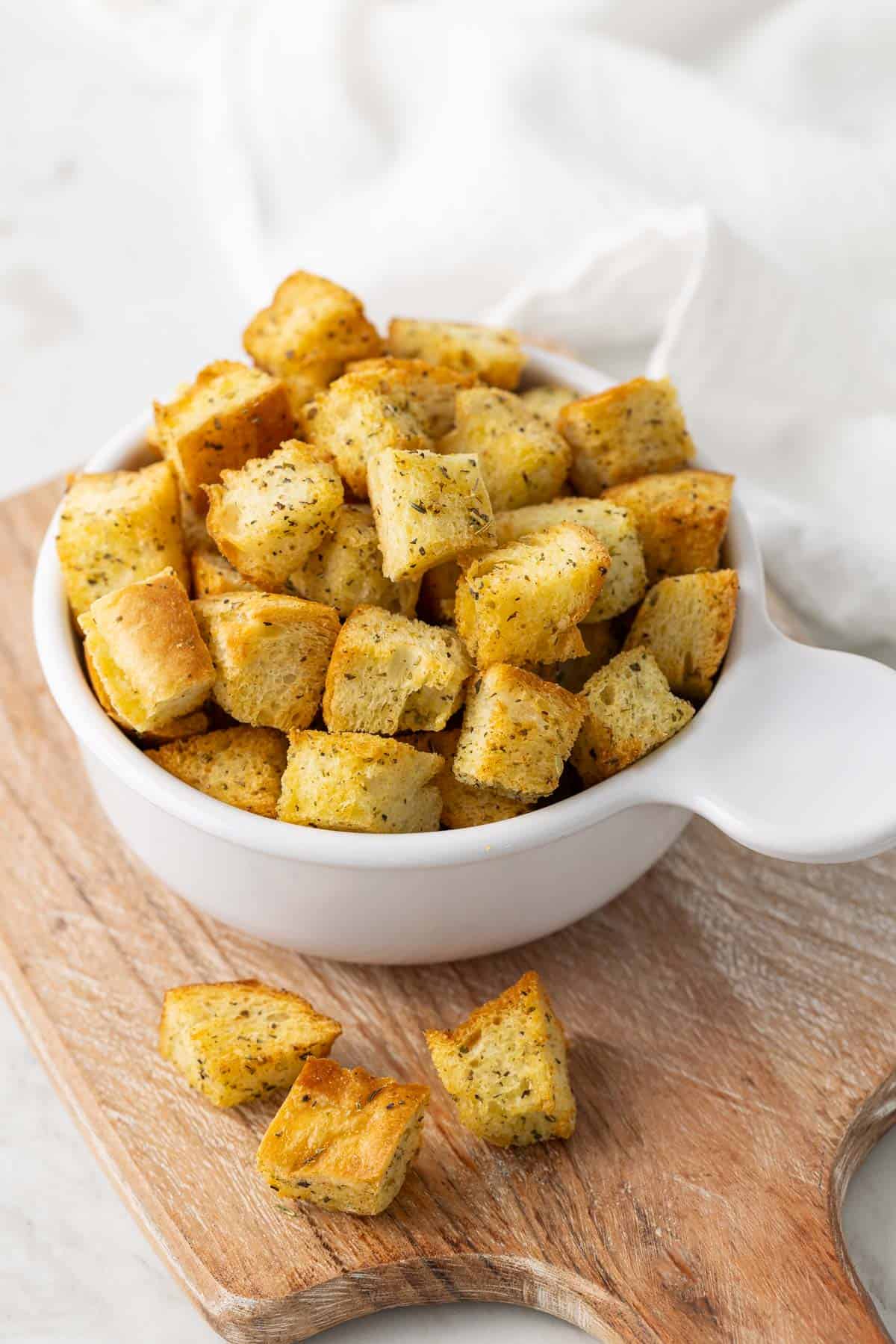 Front view of a bowl of croutons.