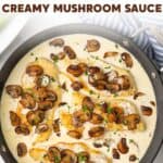 Chicken in a skillet with creamy mushroom sauce. Overlay text is at the top of the image.