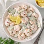 Overhead view of a bowl of cucumber shrimp salad.