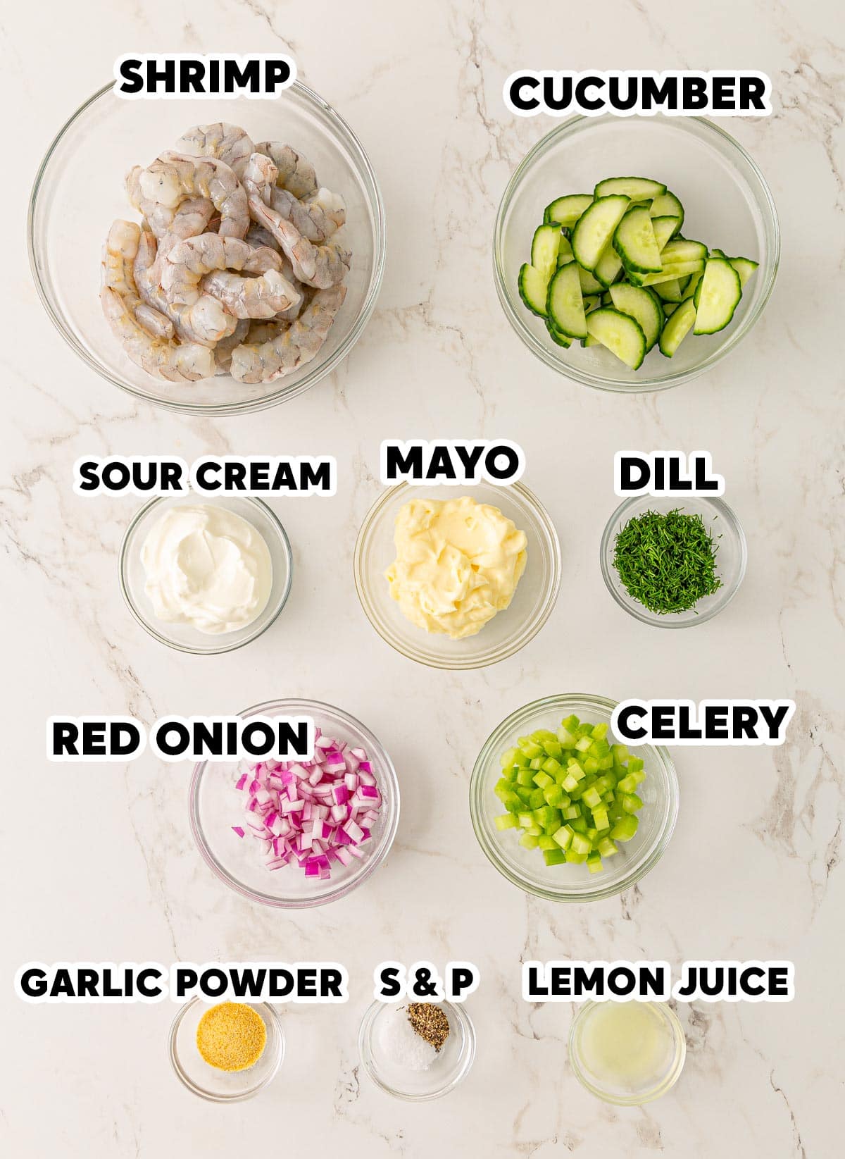 Overhead view of ingredients needed for cucumber shrimp salad with overlay text.
